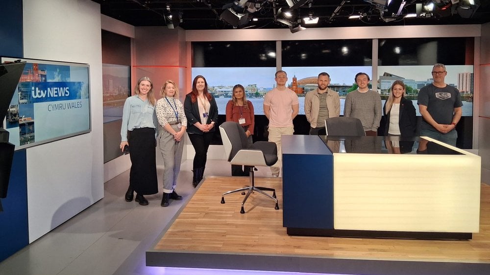 Group photo from within newsroom.